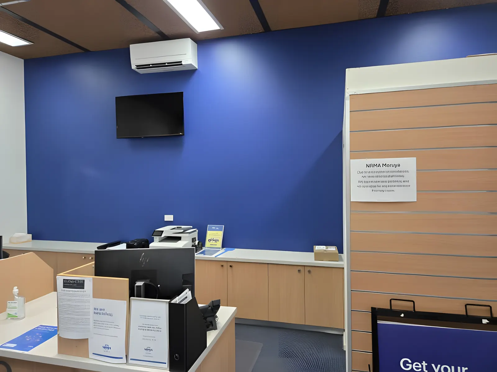 A blue feature wall in a Moruya office, freshly painted