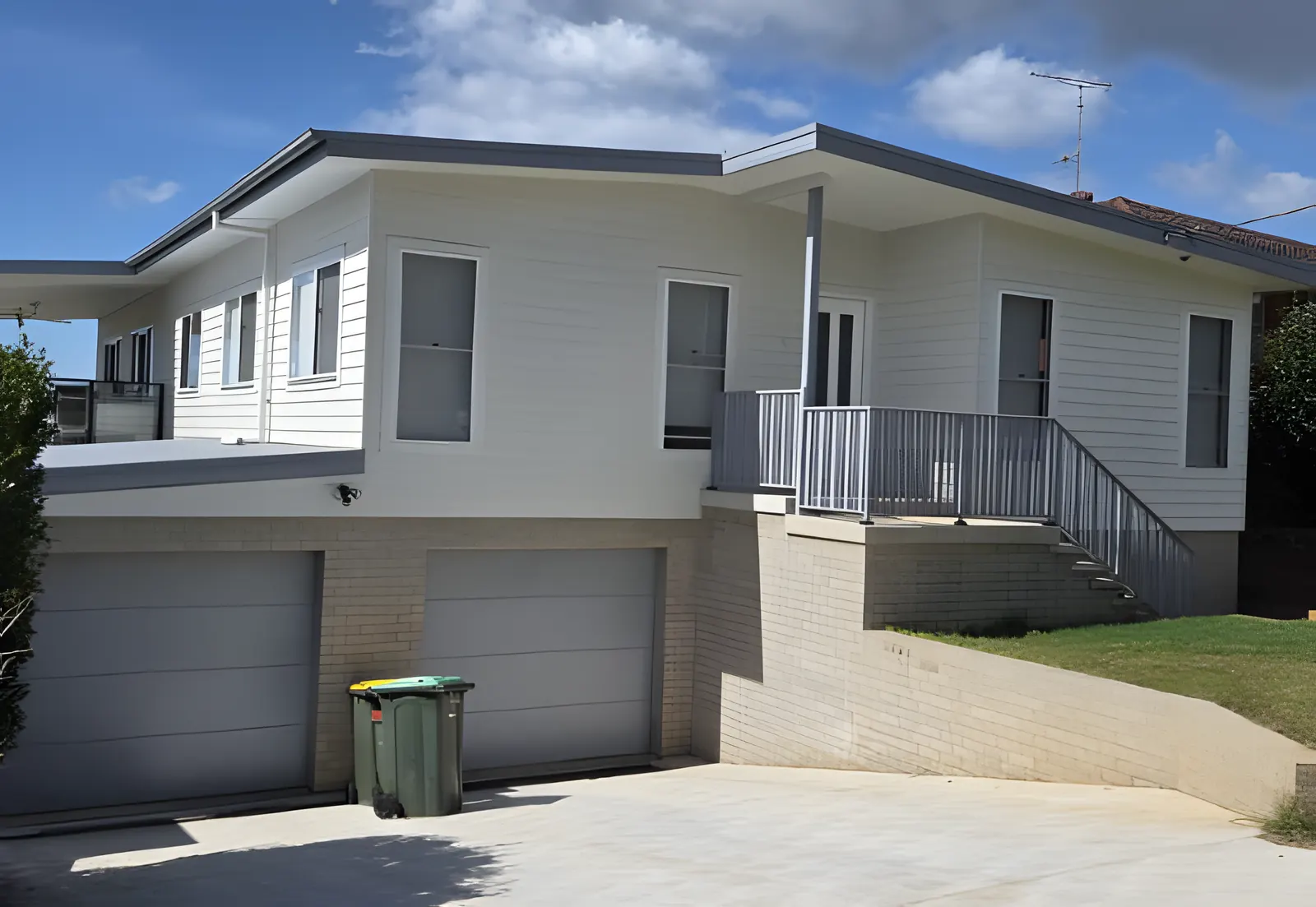 A weatherboard house with cladding, trims and fascia freshly painted